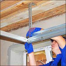 Garage door installation, garage door repair, broken cables, roller replacement, section and door. Express Garage Doors Garage Door Spring Services Lafayette Co 303 653 9438