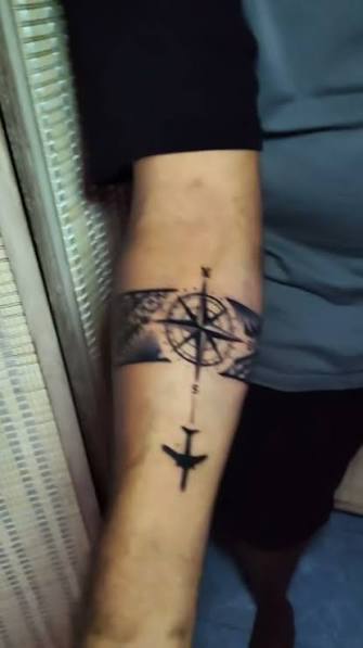 Polynesian tribal armband with compass tattoo. Clean lines and traditional Polynesian patterns combined with a compass to symbolize direction and staying true to your path. Done at Tattoo OD Studio Bangkok near