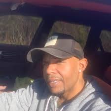 What could be causing my truck to hesitate and backfire under acceleration?