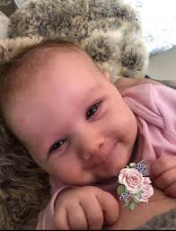 Create smiling photo of baby and parent?