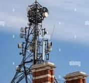 Telecommunications Tower on the roof of a building ...