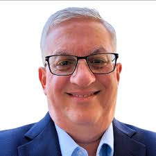 What was the TRW retirement plan in 1985, specifically regarding partial  vesting after 3 years of service?