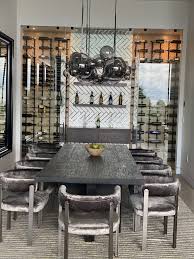 Many glass wine cellars include a mix of shelving to allow the storage of both individual bottles and cases or cartons. A Stunning Modern Glass Wine Closet In A Stylish Dining Room Wine Cellar Designers Group Las Vegas Custom Wine Cellars Racks Residential Commercial