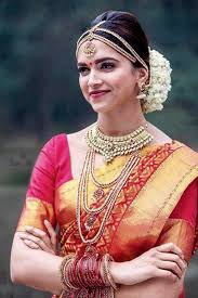 Deepika Padukone In Chennai Express Posters And Movie Stills From Chennai Express Beautiful Indian Brides South Indian Wedding Hairstyles Indian Bridal