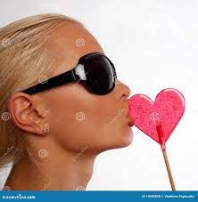 Portrait of Blond Woman Sucking Her Candy Stock Photo - Image of holiday,  eyes: 10595850