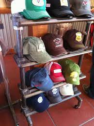 Tap For Awesome Hats Balaclavas Beanies And More At The Incredible Shire Fire Shipping Free Everywhe Hat Display Diy Hat Display Store Design Interior