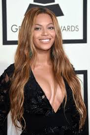 Beyonce in a cleavage baring black gown at the 2015 Grammy Awards in LA