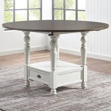 In the center of the table is a round granite lazy susan perfect for serving dishes and drinks. Steve Silver Joanna Farmhouse Round Counter Table With Drop Leaves And Lazy Susan Wilcox Furniture Pub Tables