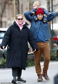 Amy schumer reveals husband chris fischer has autism spectrum disorder. Amy Schumer Goes On Delightful Family Stroll With Husband Chris Fischer And Baby Son Gene Daily Mail Online