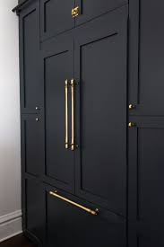 Brass Accents And Ebony Doors Make For A Darkly Dramatic Kitchen Victorian Kitchen Cheap Kitchen Cabinets Shaker Cabinet