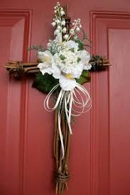 Once the funeral service is over and the grieving family begins to cope with their loss, it is completely in order for you to comfort them with flowers or a plant that shows that they can count on you for support. Easter Wreath For The Front Door Cross Shape Very Simple Wooden Cross With Light Flowers Holiday Wreaths Easter Wreaths Cross Wreath
