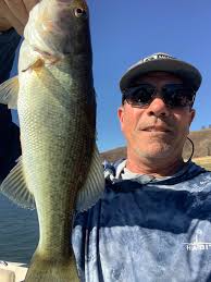 Cut shad anchored fishing different debts. Catch a couple then move. Water  is muddy 64 degrees. 23 total in just a few hours.