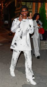 When you have court on monday over the satan shoes and might go to jail but your label tells you to keep making tiktoks. @lilnasx Lil Nas X Knows How To Make A Suit Feel Fresh Add Heels Vogue