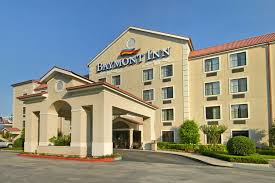Each room provides a work desk and seating area. Baymont Inn Suites