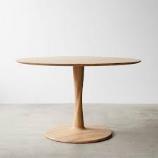 With this extendable dining table, you can always have an extra seat for guests at dinner. Euclid Natural Round Dining Table 50 Unison