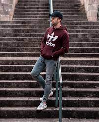 Sweaters are far more playful fashion pieces than most men tend to think. Adidas Burgundy Sweatshirt And J Brand Grey Skinny Jeans Outfit Your Average Guy