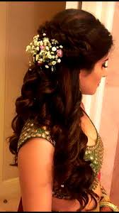 A braid crown is ideal for weddings; Pin By Amulya Sv On Hair Curls Indian Wedding Hairstyles Indian Bride Hairstyle Wedding Reception Hairstyles