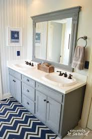 Over time a wood vanity cabinet may lose its luster from moisture, smudges and general use. Boys Bathroom Transformation Sincerely Sara D Home Decor Diy Projects Painting Bathroom Cabinets Boys Bathroom Bathroom Makeover