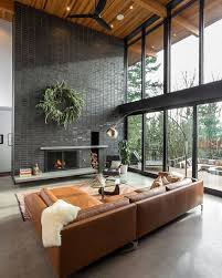 Large Windows Large Gray Fireplace And Leather Couches In A Modern Boho Living Room In 2020 Minimalism Interior Minimal Interior Design House Interior