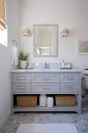 You can also find a multitude of solid color bathroom rugs for some. A White Bath Rug Sits On Gray Marble Hex Floor Tiles In Front Of Light Gray Washstand Boasting A Shelf And A White Bathroom Rug White Bath Rugs White Bathroom