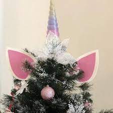 The beautiful, mythical creature is so trendy right now that one study found 24 percent of respondents planned to decorate with unicorns this christmas. New Unicorn Tree Topper Christmas Tree Themes Christmas Tags Printable Unicorn Ornaments