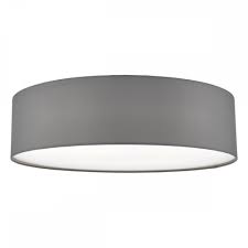 Not only does fabric inherently look softer than say metal but the fabrics in these flush mounts are also used to diffuse their light. Flush Fitting Grey Cotton Drum Shade Ceiling Light With Diffuser