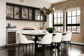 Spacious seating for added comfort. White Dining Chairs With Black Legs And Black Dining Table Transitional Dining Room