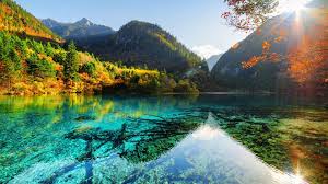 Check spelling or type a new query. Pemandangan Indah Pemandangan Pegunungan Pohon Kuning Hijau Refleksi Di Latar Belakang Sinar Matahari Sungai Alam Hd Wallpaper Desktop Layar Lebar Definisi Tinggi Layar Penuh