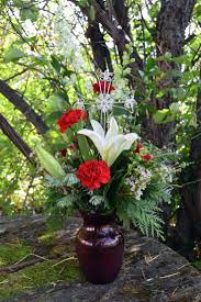 Myrrh Gillespie Florists Indianapolis In Festive Red Glass Vase Is Filled With White Larkspur White Wax Flower Christmas Flowers Winter Flower Arrangements