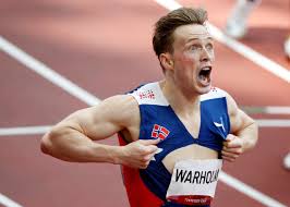 Karsten warholm celebrates winning the gold medal and setting a new world record of 45.94 in the mens 400m hurdles. L7dxsf3hu1ehlm