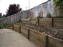 Retaining Wall With 2x12 Pressure Treated Wood 2 Landscaping Retaining Walls Sloped Backyard Landscaping Building A Retaining Wall