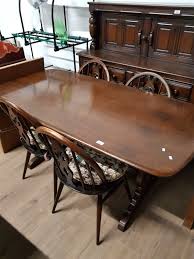 Fleur de lys carved into backrests original golden dawn finish (but also look great painted). 1960s Ercol Dining Table And 4 Chairs