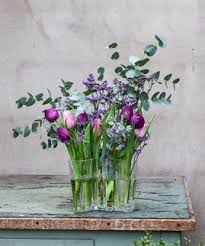 Tulips And Eucalyptus In Aalto Vase Arrangement Is Made With Flower Support Invase Www Kukkaverstas Fi Vase Flowers Flower Vases