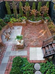 Having an outdoor sofa in your yard will instantly make the space feel more inviting. Transitional Brick Patio Offers A Private Space To Entertain Small Backyard Landscaping Small Backyard Landscaping Ideas Backyard Landscaping