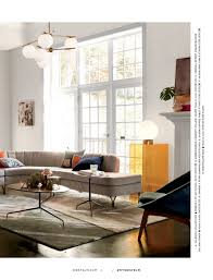 This rustic coffee table, with a modern twist, is made from natural materials (solid mango tree), and it has a great mechanical arm system which pops the table's doors open to reveal a hidden storage perfect for storing books. West Elm April 2017 Page 50 51