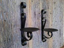 6% coupon applied at checkout. Two Metal Candle Wall Sconce Rustic Black Wrought Iron Wall Etsy Metal Candle Holders Wall Candle Holders Rustic Wall Sconces