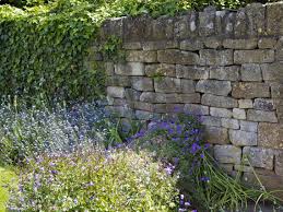 Perhaps the ultimate garden wall is created by a creeping vine slowly covering the hard surfaces of build a standing garden upwards by stacking planters on top of garden walls or one another to. 13 Garden Wall Ideas That Will Create A Blissful Outdoor Oasis Bidvine