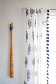 It looks even cooler if you put a bold wallpaper underneath. Sports Decor For A Boys Room At Charlotte S House