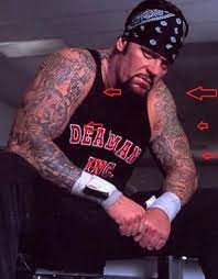 The undertaker once had the name of his first wife sara engraved onto the front of his neck. Undertaker S 4 Tattoos Their Meanings Body Art Guru