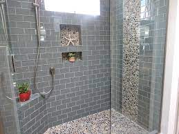 Bathroom renovated with mosaic of grey tiles. Ocean Glass Subway Tile Bathroom Remodel Shower Farmhouse Shower Glass Tile Shower