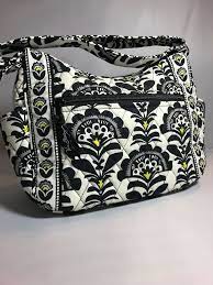 This pretty printed ceramic mug holds 12 ounces of your favorite hot beverage.all that's missing is cream and sugar! Vera Bradley Black Brown Yellow White Floral Print Small Tote Purse Handbag Verabradley Tote Purses And Handbags Small Tote Tote Purse