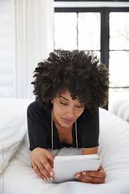 African American Woman Working On Tablet In Bedroom African American Women American Women African American