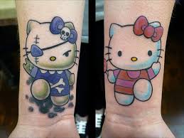 Hello kitty has been an adorable fixture in our pop culture for the last 40 years and fans have been inking themselves with the cute cat for almost as long. 35 Cute And Crazy Hello Kitty Tattoo Design Ideas For Females Hello Kitty Tattoos Hello Kitty Nails Cat Tattoo