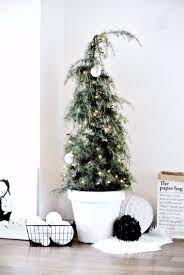 Setting the stage is a turquoise deer head. Ceder Christmas Tree Xmas Blackwhite Small Christmas Trees Scandinavian Christmas Christmas Tree Decorations