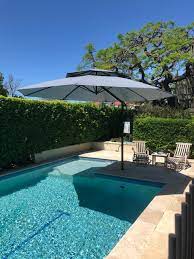 Here comes a patio umbrella, which provides you with such a large shade to enjoy the beautiful life of summer. Pool Umbrellas Tropical Swimming Pool Hot Tub By Tropicover Umbrellas Houzz Uk