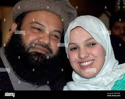 Scottish girl Molly Campbell, also known as Misbah Iram Ahmed Rana leaves  Pakistan's Supreme Court with her father Sajad Ahmed Rana in Islamabad,  Pakistan, Thursday, Jan 18, 2007. The father will have