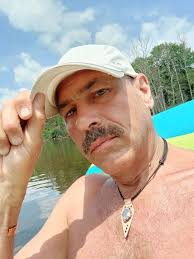 Girl peeking from trailer in Danbury, WI