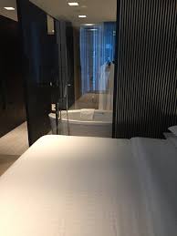 Bedrooms with freestanding bathtubs or and contemporary glass showers are one of the most popular bathroom remodeling projects that create more spacious and bright rooms. Bedroom With A Glass Wall Between The Bathroom Picture Of Sheraton Grand Hotel Dubai Tripadvisor
