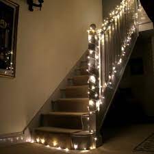 Wind the twinkly lights around your rail for some extra light on your way up at night and make your staircase look like a forest of fireflies lighting the way to bed. Affordable Home Decor Christmas Lights And Decorations Warm White Fairy Lights White Fairy Lights Christmas Lights