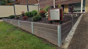 Ridgi Ironbark Concrete Sleeper Steel Post Retaining Wall For More Information Visit Rid Concrete Sleeper Retaining Walls Retaining Wall Landscaping A Slope